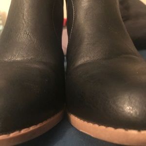 Black faux leather booties.